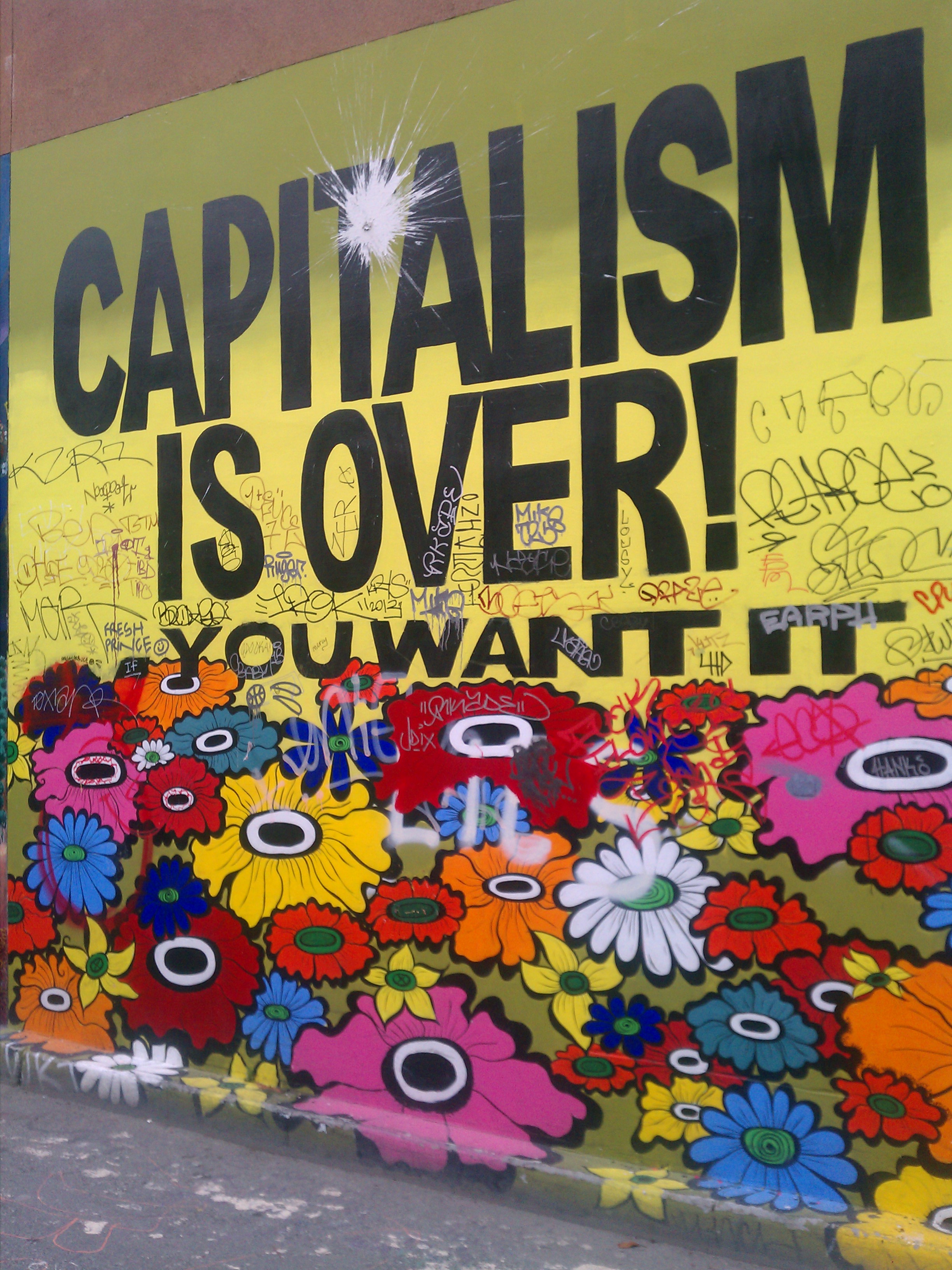 Mural which reads capitalism is over.